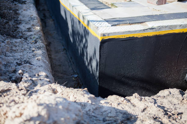 Professional Waterproofing technician working in Sheridan, MI